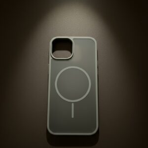 Gray MagSafe iPhone 13 case with magnetic ring and camera cutout on dark background.
